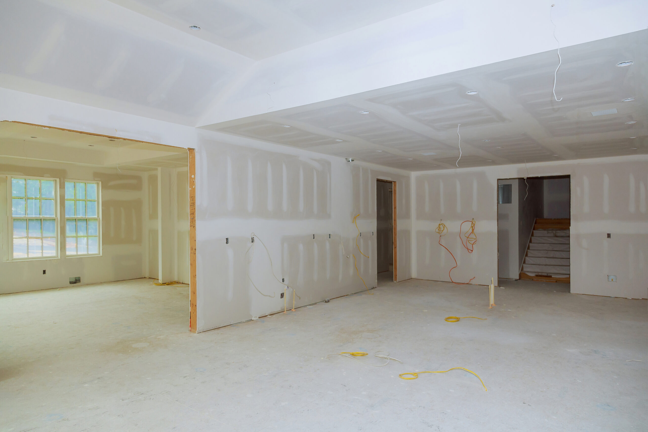 Drywall installation and finishing in a home under renovation